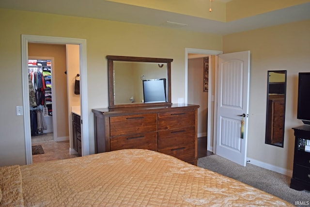 3201 Helmsford Ct, Evansville, IN 47715 - bedroom featuring a walk in closet, a closet, and baseboards