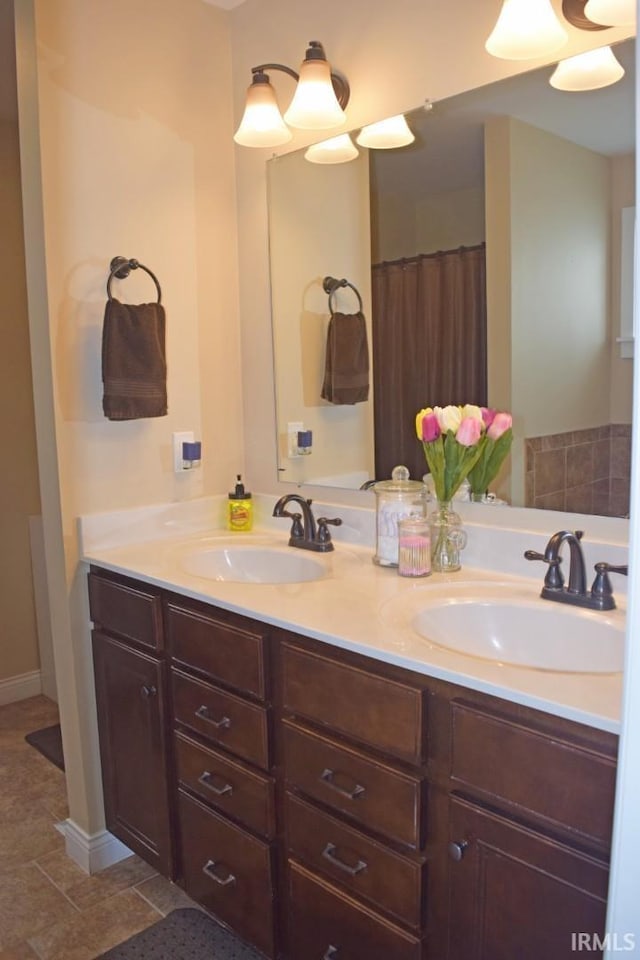 3201 Helmsford Ct, Evansville, IN 47715 - full bath featuring double vanity, tile patterned floors, and a sink