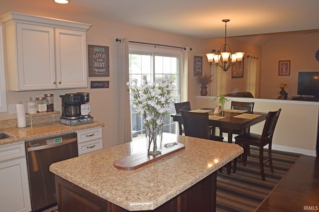 3201 Helmsford Ct, Evansville, IN 47715 - kitchen with white cabinets, stainless steel dishwasher, dark wood-style flooring, and an inviting chandelier