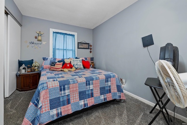 carpeted bedroom with baseboards