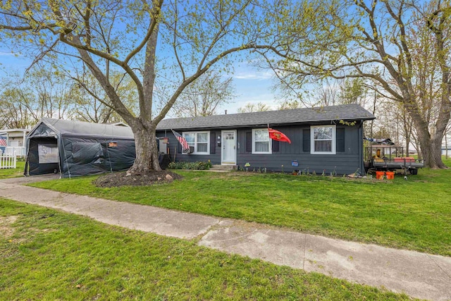 single story home featuring entry steps and a front yard