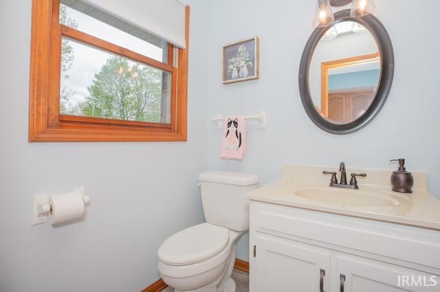 bathroom with toilet and vanity