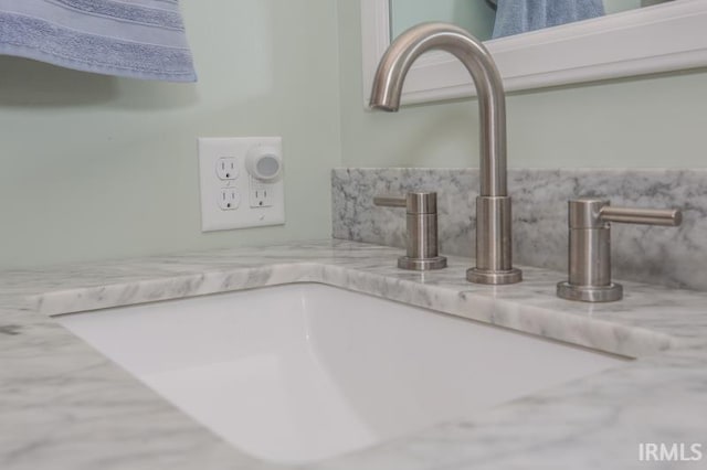 room details with backsplash and a sink
