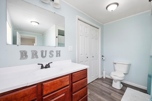 357 Mount Auburn St, Dunkirk, IN 47336 - bathroom with toilet, crown molding, vanity, and wood finished floors