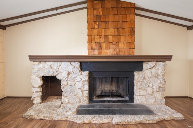 357 Mount Auburn St, Dunkirk, IN 47336 - room details featuring baseboards, beam ceiling, wood finished floors, and a stone fireplace