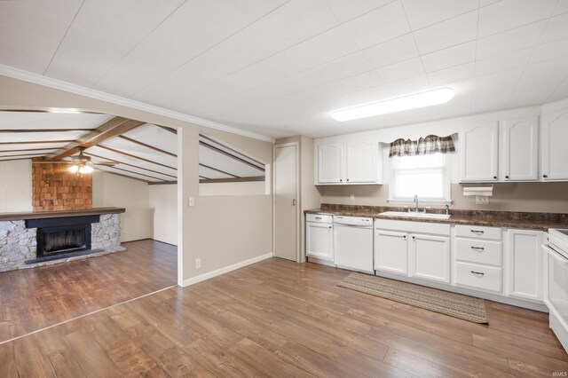 357 Mount Auburn St, Dunkirk, IN 47336 - kitchen with light wood finished floors, dark countertops, dishwasher, a sink, and white cabinetry