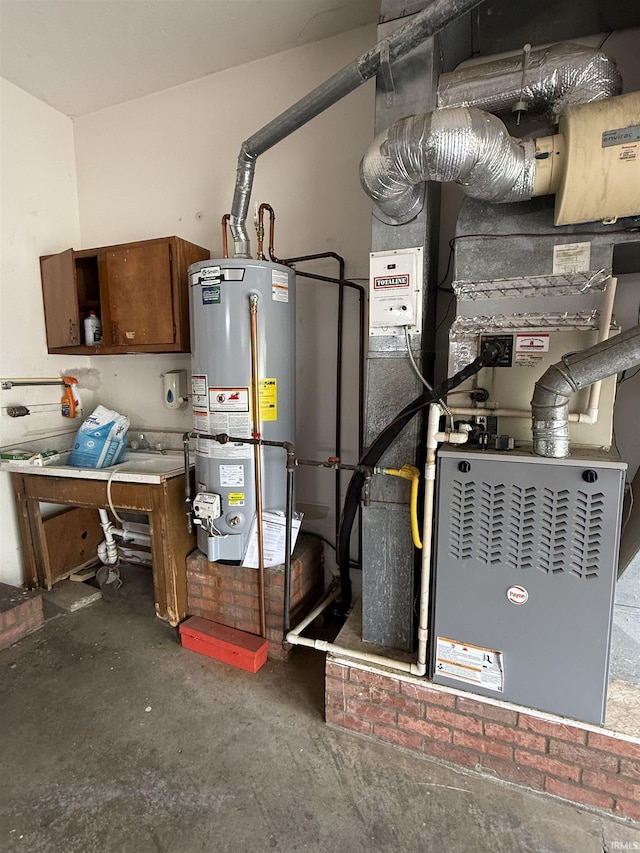 utility room featuring gas water heater