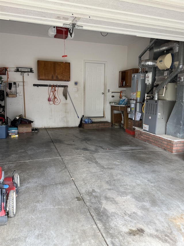 garage featuring water heater and a garage door opener