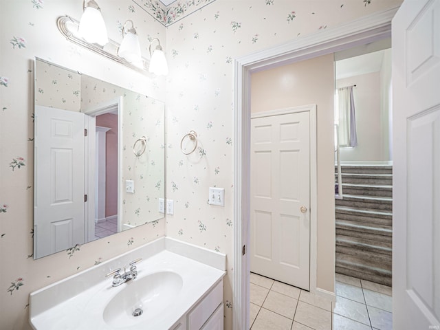 bathroom featuring tile patterned floors, vanity, and wallpapered walls