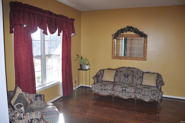 living area with wood finished floors and baseboards
