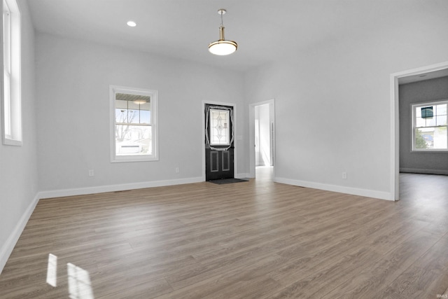 interior space with light wood-style flooring and baseboards