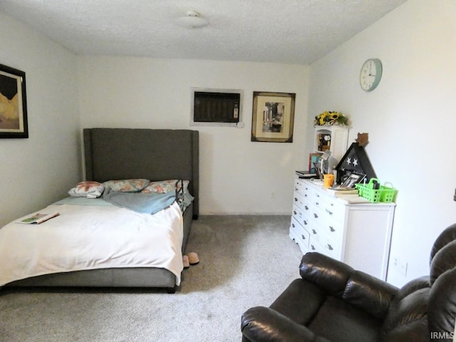carpeted bedroom with a textured ceiling