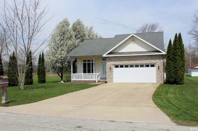 view of front of house featuring a garage, a front yard, concrete driveway, and covered porch