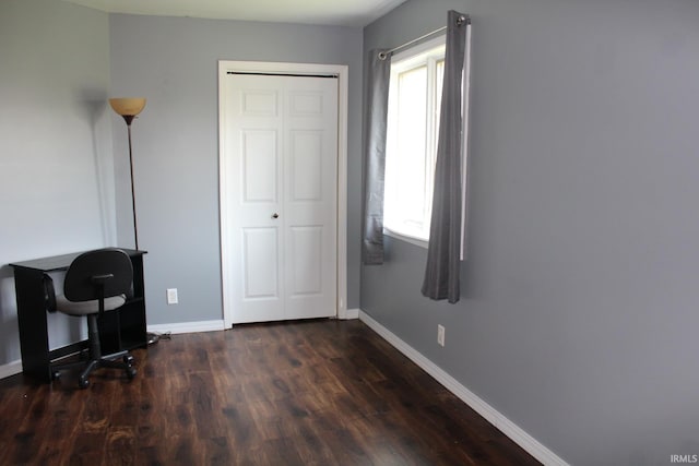 office area featuring baseboards and dark wood-style floors