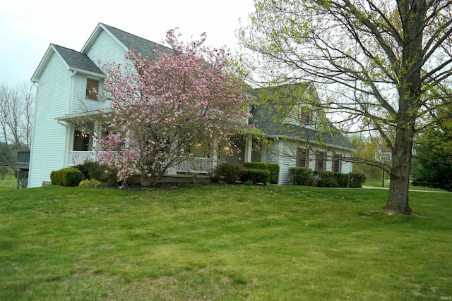 view of home's exterior with a yard