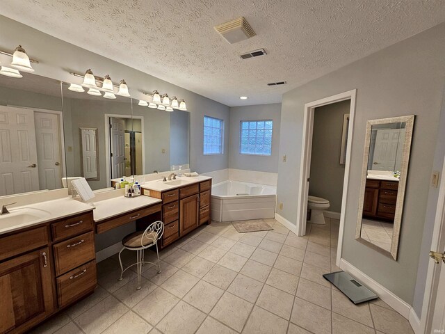 bathroom featuring tile patterned floors, a garden tub, visible vents, and toilet