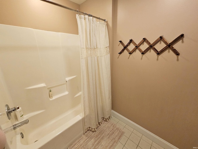 full bathroom with shower / tub combo, baseboards, and tile patterned flooring