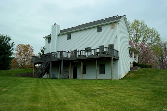 rear view of property featuring stairway, a wooden deck, a chimney, and a yard