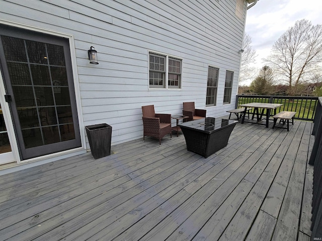 wooden deck featuring outdoor dining area