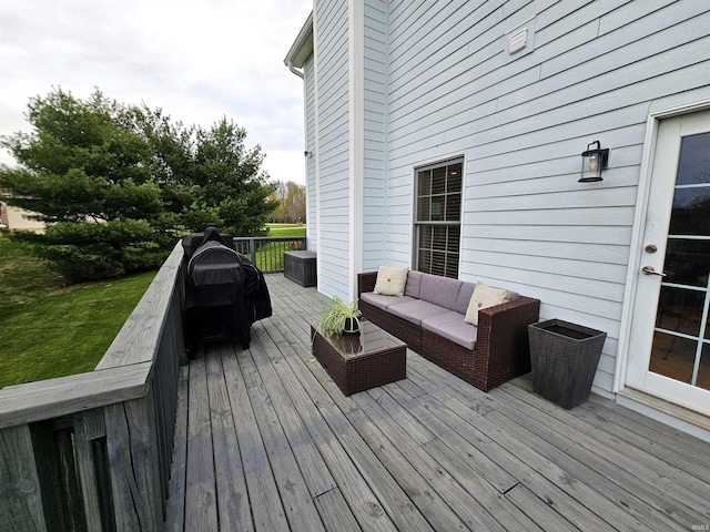 wooden deck with an outdoor living space