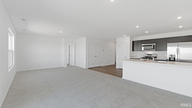 3353 Sika Trl, Waterloo, IN 46793 - unfurnished living room featuring carpet flooring and recessed lighting