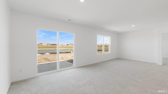 3353 Sika Trl, Waterloo, IN 46793 - unfurnished room featuring carpet floors, recessed lighting, and a water view