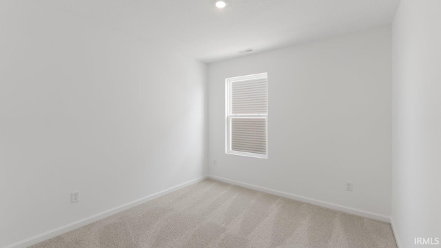3353 Sika Trl, Waterloo, IN 46793 - empty room with light carpet and recessed lighting