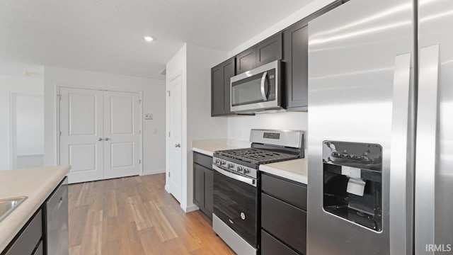 3353 Sika Trl, Waterloo, IN 46793 - kitchen with stainless steel appliances, light wood-type flooring, light countertops, and recessed lighting