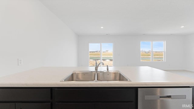 3353 Sika Trl, Waterloo, IN 46793 - kitchen with stainless steel dishwasher, dark cabinets, open floor plan, light countertops, and recessed lighting