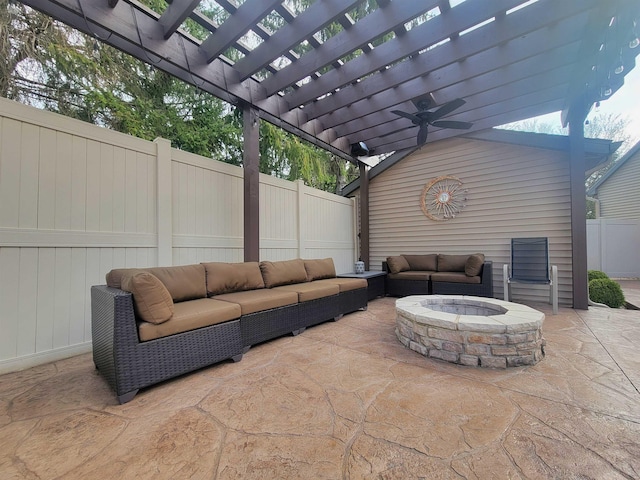 view of patio featuring a pergola, an outdoor living space with a fire pit, and fence