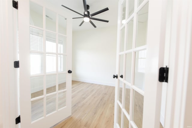 4026 W Carmola Dr, Bloomington, IN 47404 - empty room featuring light wood-style floors, a ceiling fan, baseboards, and french doors