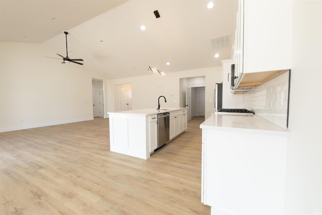 4026 W Carmola Dr, Bloomington, IN 47404 - kitchen featuring white cabinets, light countertops, appliances with stainless steel finishes, and a sink