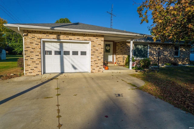 ranch-style house with brick siding, driveway, and a garage