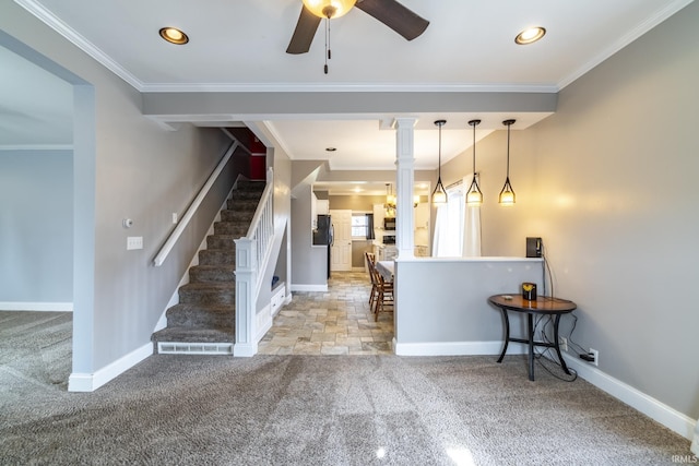 foyer entrance featuring baseboards, carpet flooring, stairs, and ceiling fan