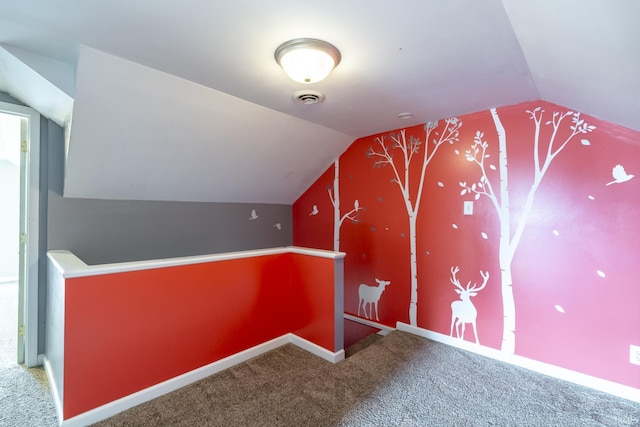 bonus room featuring vaulted ceiling, carpet flooring, visible vents, and baseboards