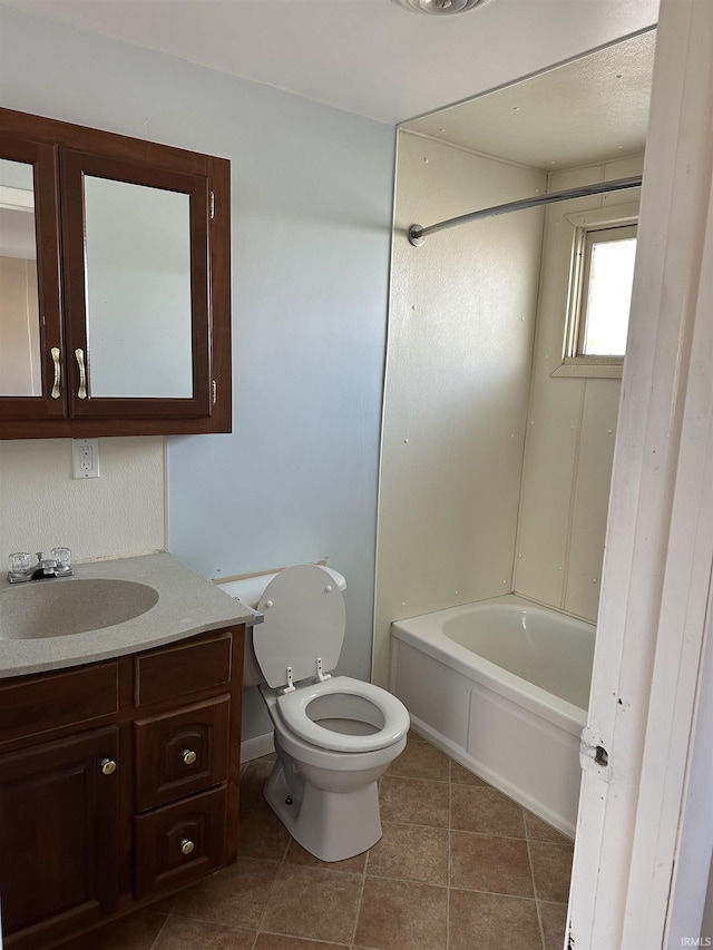 full bath with toilet, vanity, tile patterned floors, and tub / shower combination