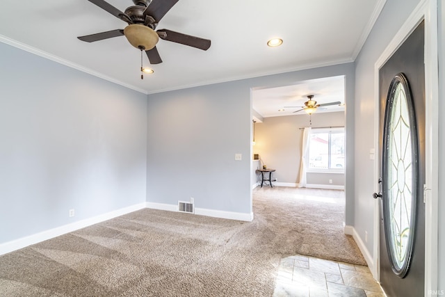 empty room with light carpet, a ceiling fan, visible vents, and baseboards
