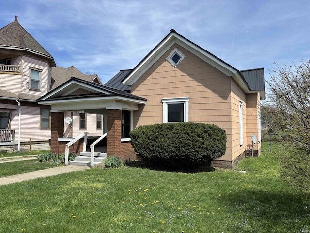 bungalow-style house featuring a front yard