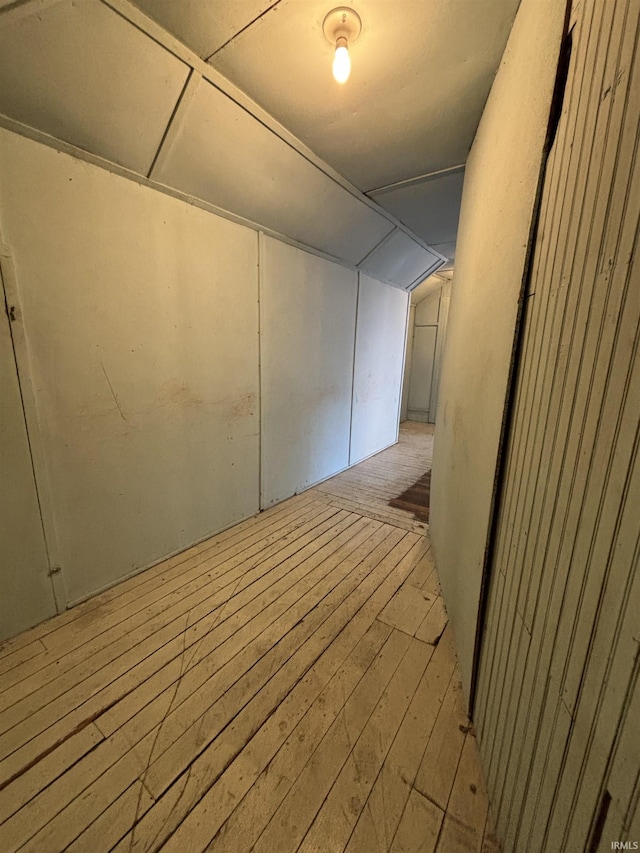 interior space featuring lofted ceiling and light wood-type flooring