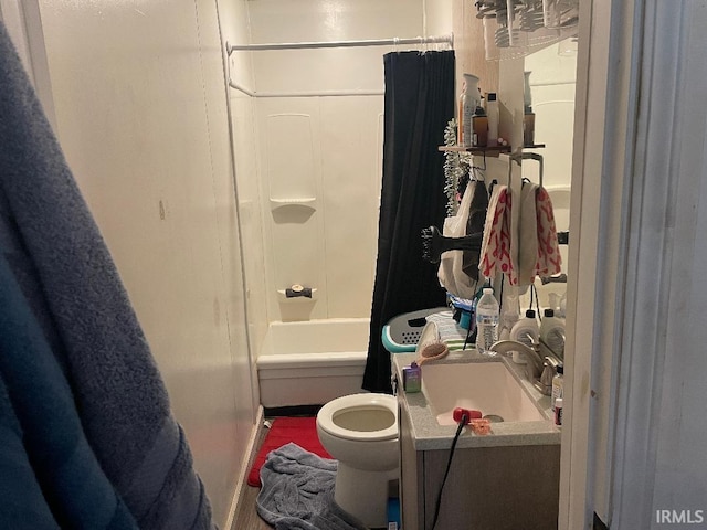 full bath featuring shower / tub combo, toilet, and vanity