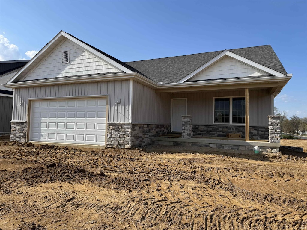 200 W Tampa St Unit 1, Culver, IN 46511 - craftsman house with stone siding, covered porch, and a garage