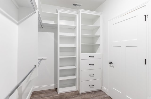 1033 Triple Crown Dr, Evansville, IN 47725 - walk in closet featuring visible vents and wood finished floors