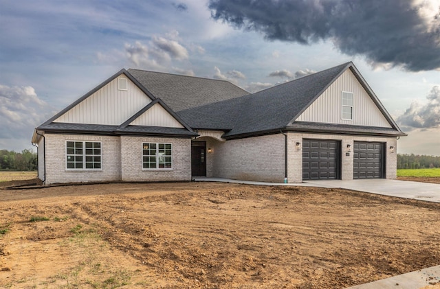 1033 Triple Crown Dr, Evansville, IN 47725 - traditional-style home featuring a garage, concrete driveway, and brick siding