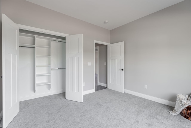 1033 Triple Crown Dr, Evansville, IN 47725 - unfurnished bedroom featuring carpet flooring, baseboards, and a closet