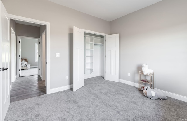 1033 Triple Crown Dr, Evansville, IN 47725 - unfurnished bedroom with carpet flooring, baseboards, and a closet
