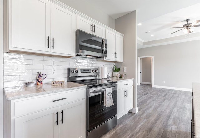 1033 Triple Crown Dr, Evansville, IN 47725 - kitchen featuring decorative backsplash, white cabinetry, a ceiling fan, and stainless steel appliances