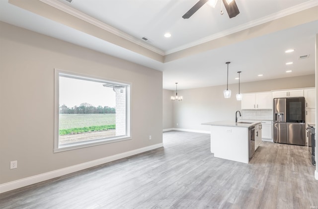 1033 Triple Crown Dr, Evansville, IN 47725 - kitchen with decorative backsplash, a sink, ceiling fan with notable chandelier, ornamental molding, and stainless steel appliances