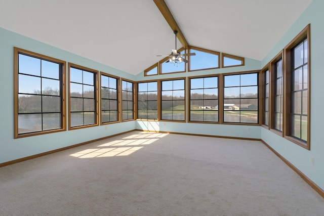 unfurnished sunroom with carpet floors, baseboards, and lofted ceiling with beams