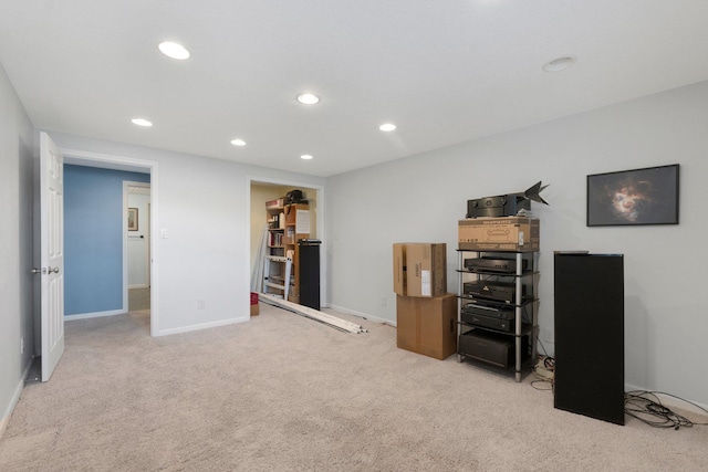 interior space featuring recessed lighting, baseboards, and light colored carpet