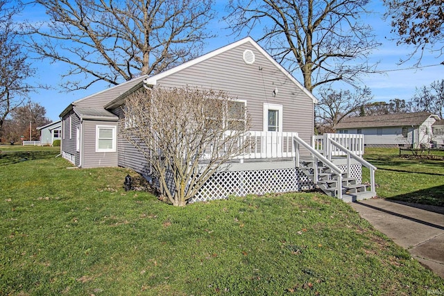 view of front of house with a front lawn and a deck